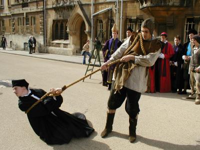 Thomas Cranmer, Edwardian Archbishop of Canterbury (Ned Dalby), guard and cast in background