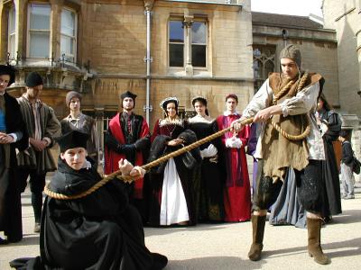 Thomas Cranmer, Edwardian Archbishop of Canterbury (Ned Dalby), guard and cast in background