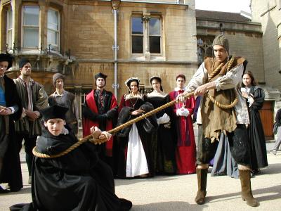 Thomas Cranmer, Edwardian Archbishop of Canterbury (Ned Dalby), guard and cast in background